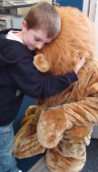 Lad meets Lion - hugs all round